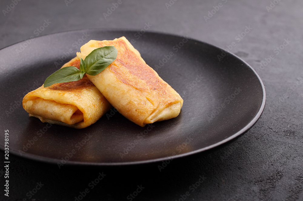 Close up of rolled pancakes with meet Close up of rolled pancakes with meet