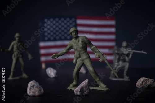 Toy soldiers in front of an American flag