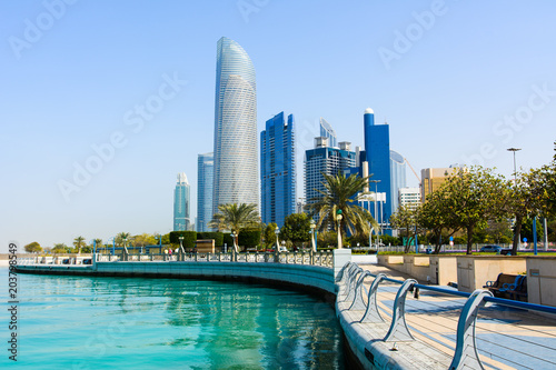 Modern buildings of downtown Abu Dhabi view from the walking area by the seaside
