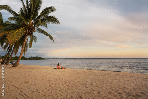 Couple at sunset on the Caribbean sea in Cuba © Angelo D'Amico