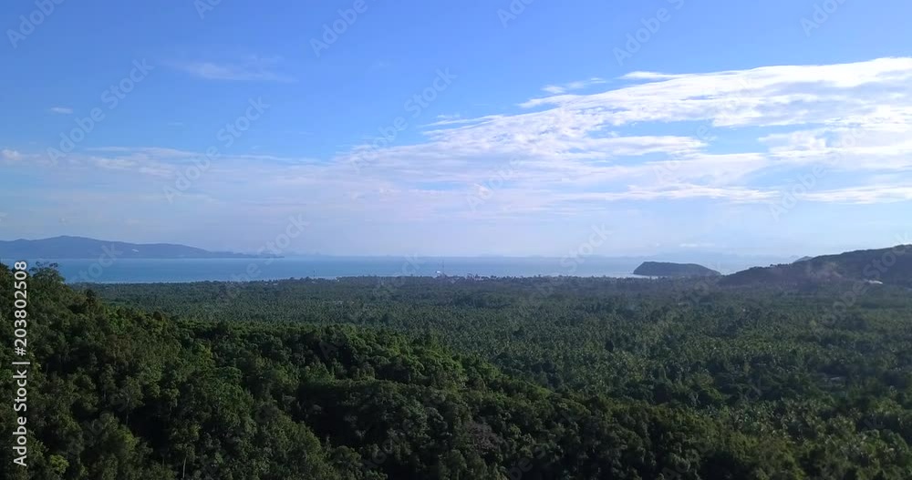 Hiker walking admiring beautiful view overlooking on the sea view with rising hands over koh Phangan island,Thailand Hiker walking admiring beautiful view overlooking on the sea view with rising hands over koh Phangan island,Thailand