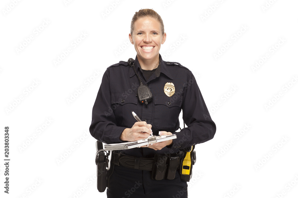 Smiling female police officer writing report Smiling female police officer writing report