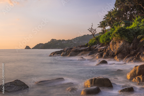 Kalim beach in Patong, Phuket, Thailand. Rock beach with strong wave, long exposure make it harmonic view. Capture this in the evening. © eltonmaxim