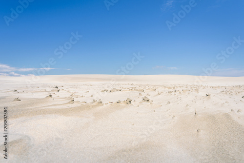 Farewell Spit  Golden Bay  New Zealand  Impressive sand dune landscape at the north west cape of south island with white sandy beaches and green grass and blue ocean sea near Abel Tasman National Park