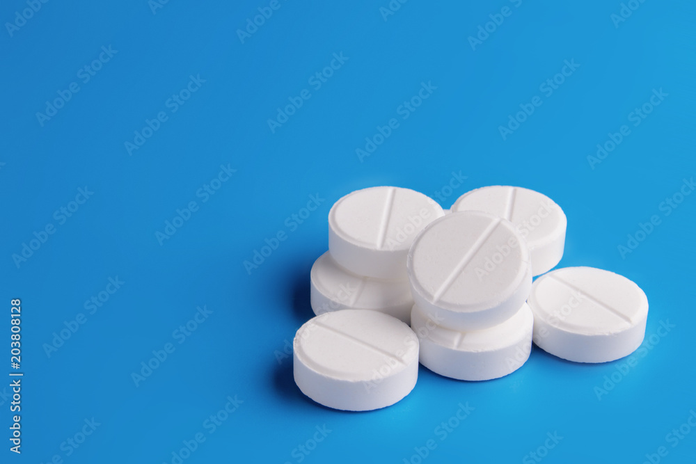 white pills on a blue background, medicine white pills on a blue background, medicine