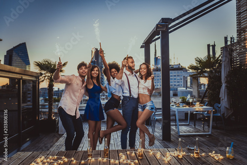 Friends partying on a rooftop