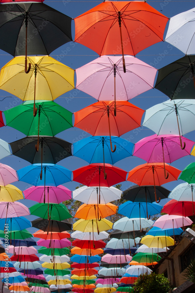 Sun umbrellas against the sky