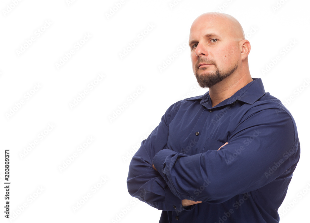 Handsome man with smirk and arms crossed. Handsome man with smirk and arms crossed.