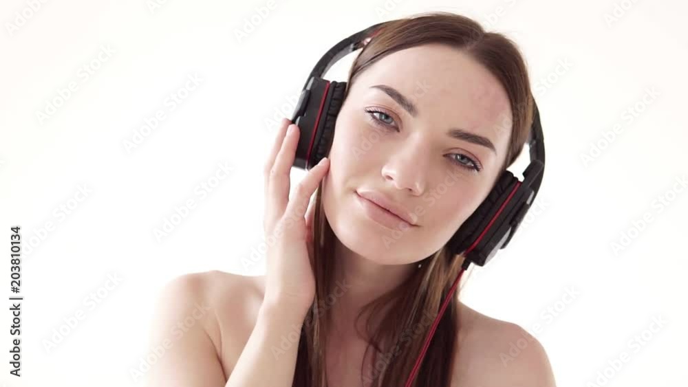 Portrait of a woman with big headphones with music Portrait of a woman with big headphones with music