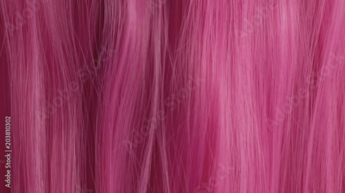Closeup of pink hair creative colored texture slow movement of hair pink hair texture