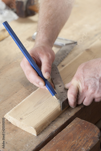 carpenter drawing on a wooden board.copy space