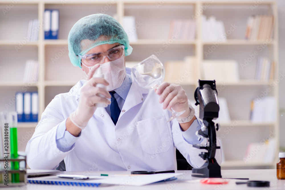 Forensics investigator working in lab on crime evidence Forensics investigator working in lab on crime evidence