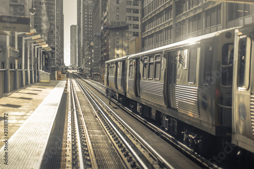 Fotografie Train leaving station in early morning