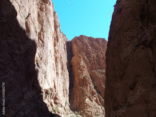 Spectacular rocky slope of TODGHA GORGE canyon landscape in MOROCCO at High Atlas Mountains range at Dades Rivers photo