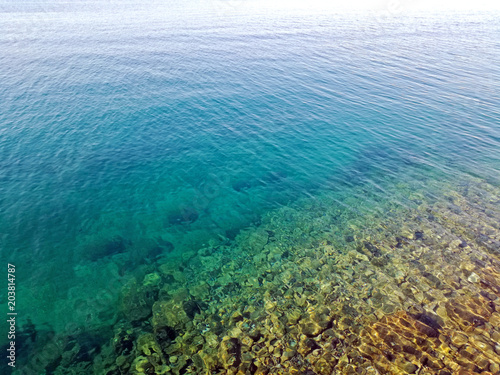 Clear turquoise coast in Croatia  sea horizon image. Beautiful summer sea view.
