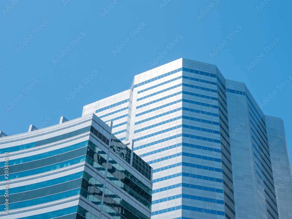 Angle view of modern building with a clear blue sky in background Angle view of modern building with a clear blue sky in background
