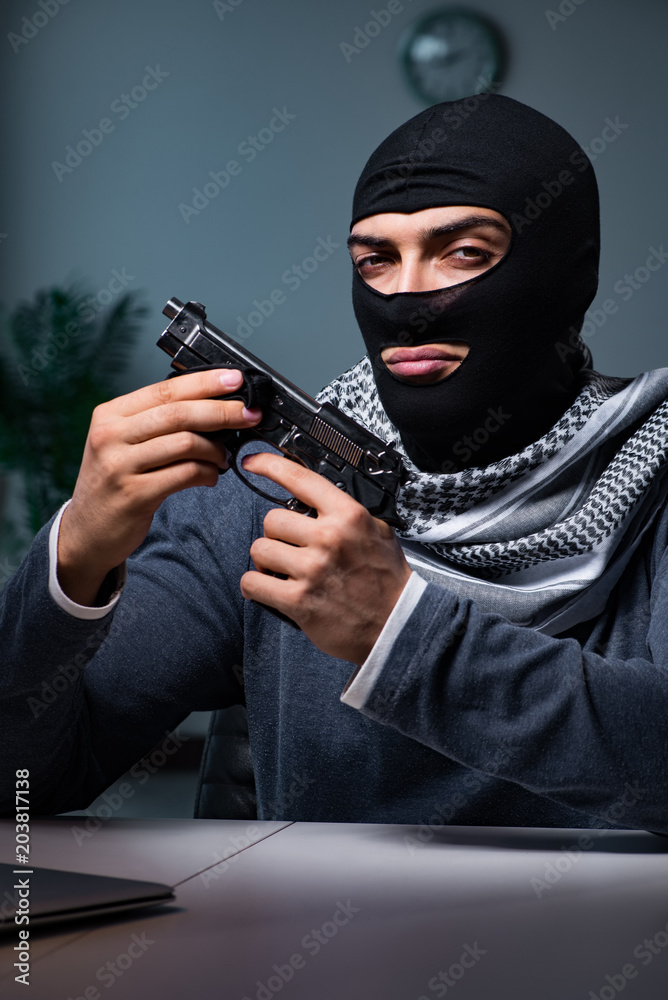 Terrorist burglar with gun asking for money ransom Terrorist burglar with gun asking for money ransom