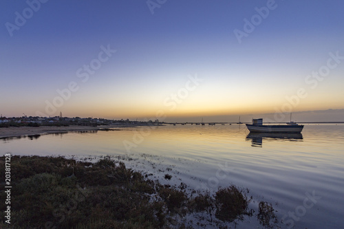 Dawn seascape of Ria Formosa wetlands natural park, shot in Cavacos beach. Algarve.