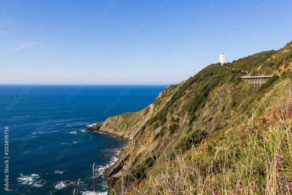 Great views of Cape Villano and Gorliz lighthouse on coast of Biscay by Cantabrian Sea, north Spain