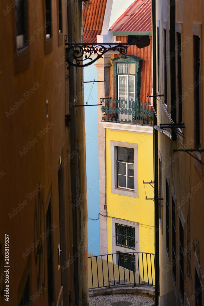 Narrow street in Old Town of Lisbon, Portugal