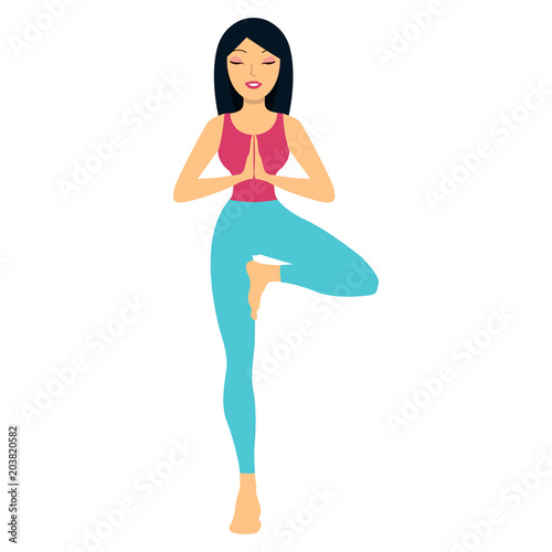 Young woman practicing yoga, standing in tree exercise, Vrksasana pose