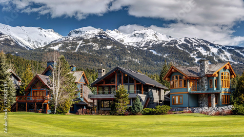 Luxury Homes on Nicklaus North Golf Course in Whistler on a sunny Spring day with Blackcomb Mountain in the background. Whistler, British Columbia Canada