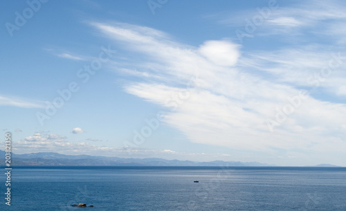 A serene seascape with a coastline