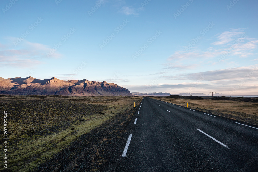 Road in Iceland in sunrise light, autumn