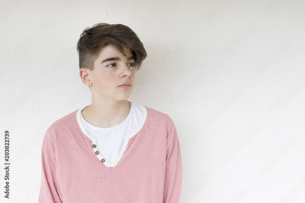 fashionable teenage boy on the white wall fashionable teenage boy on the white wall