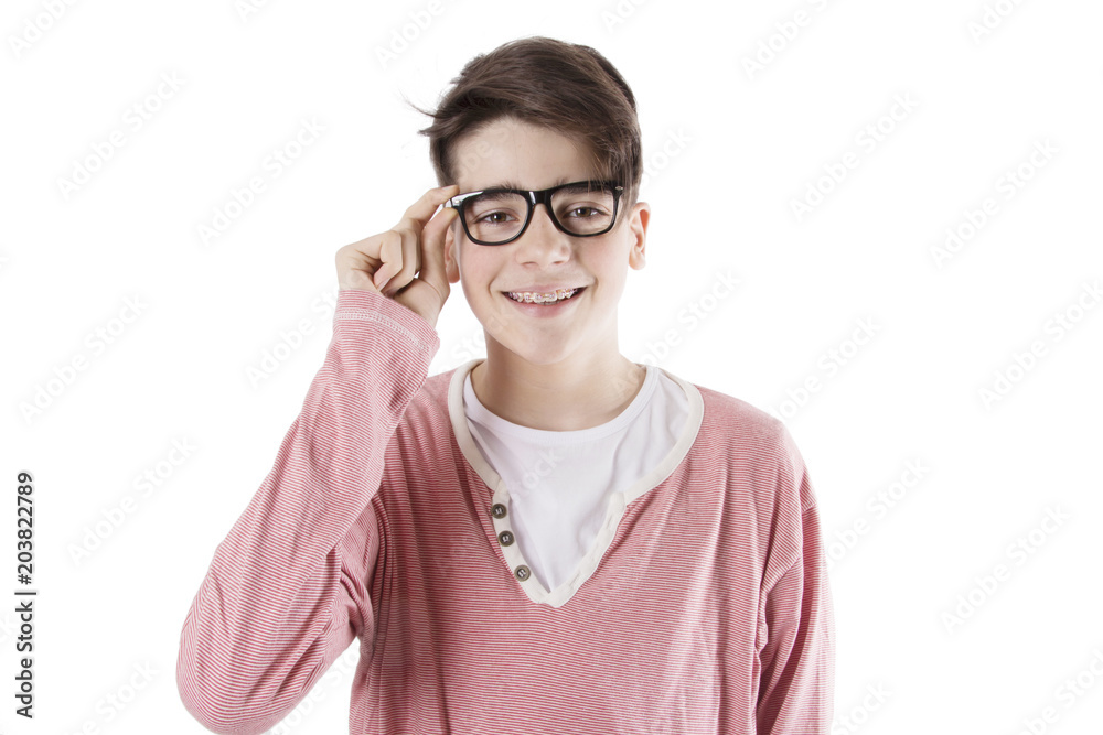 teenager with glasses and fashion braces on the white wall