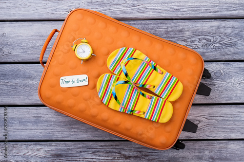 Wanderlust and summer travel concept. Grey wooden desk surface background. photo