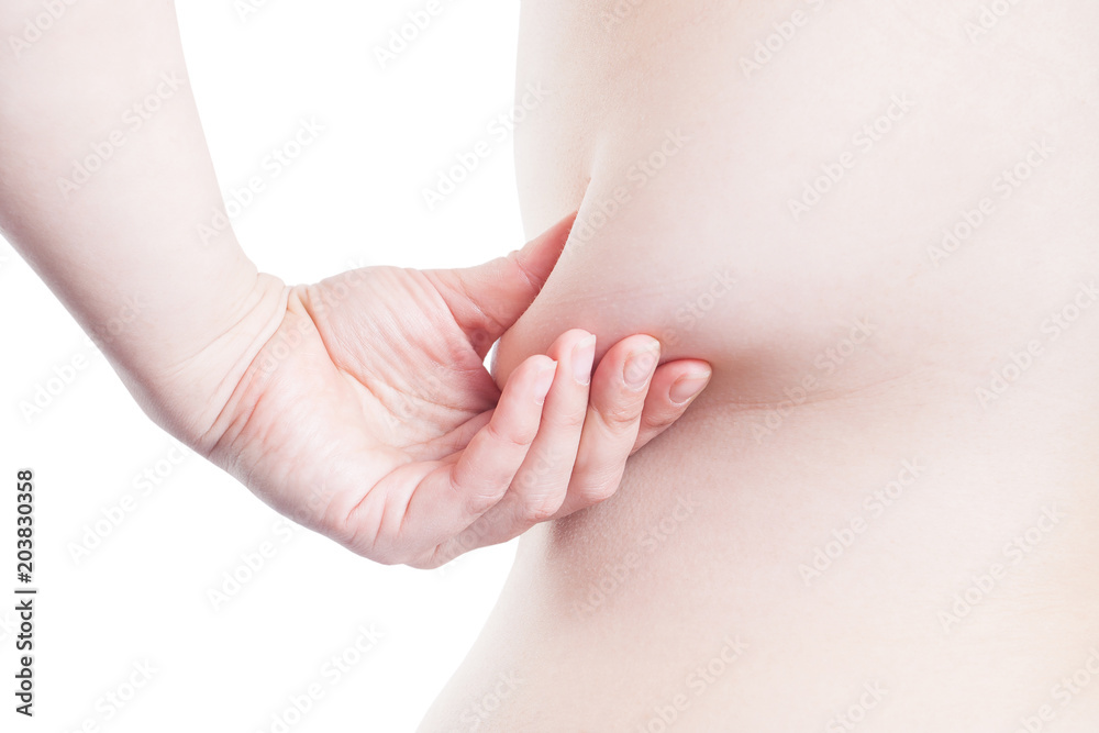large fold of fat on the side of a woman (overweight, obesity) large fold of fat on the side of a woman (overweight, obesity)