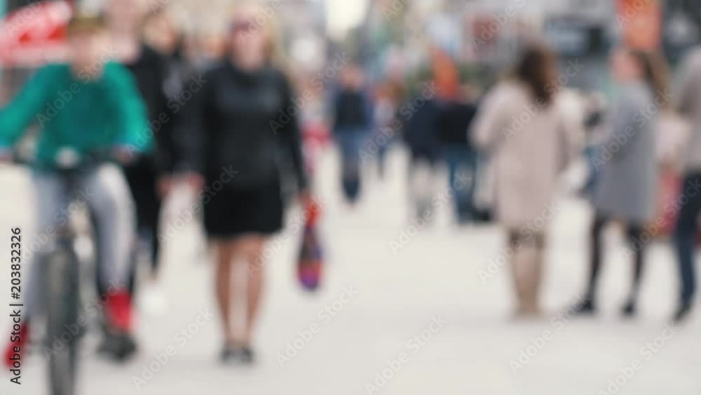 People walking blur. Out of focus background from city with people in weekend. Street filled with anonymous crowd. Anonymous crowd of people walking on pedestrian street People walking blur. Out of focus background from city with people in weekend. Street filled with anonymous crowd. Anonymous crowd of people walking on pedestrian street