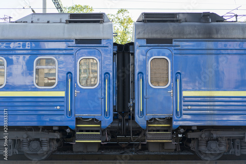 two blue passenger wagons