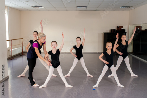 The choreographer teaches children dances.