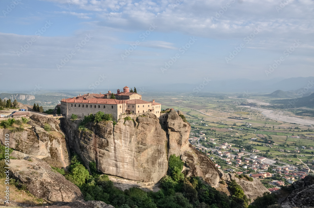 Monastery Meteora Greece. Stunning spring panoramic landscape. View at mountains and green forest. Unesco heritage list object.