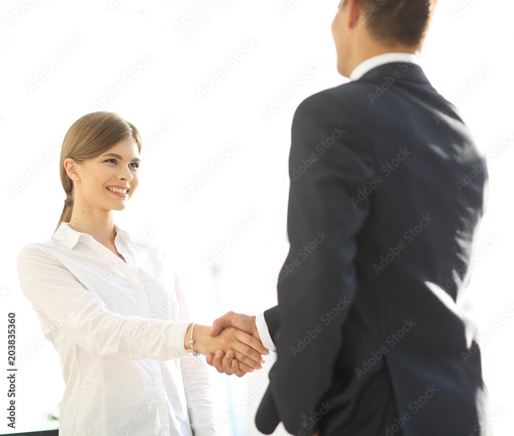 handshake young business woman with a colleague handshake young business woman with a colleague