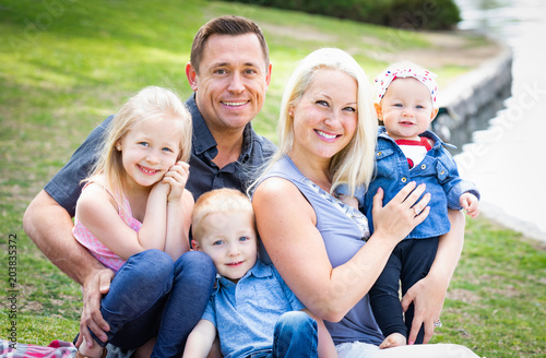 Happy Young Caucasian Famil...