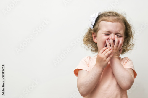 Girl crying over white background