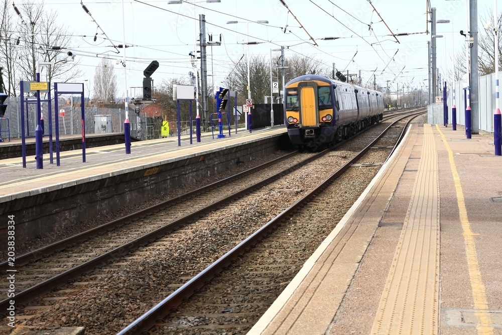 image of a local train approaching the station image of a local train approaching the station