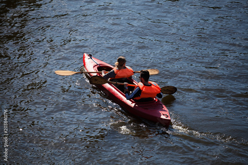 Two sail in a kayak