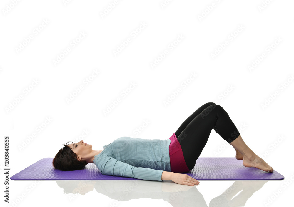 Mother woman exercising doing postnatal workout. Female fitness instructor stretching hands and legs in gym and work out exercises