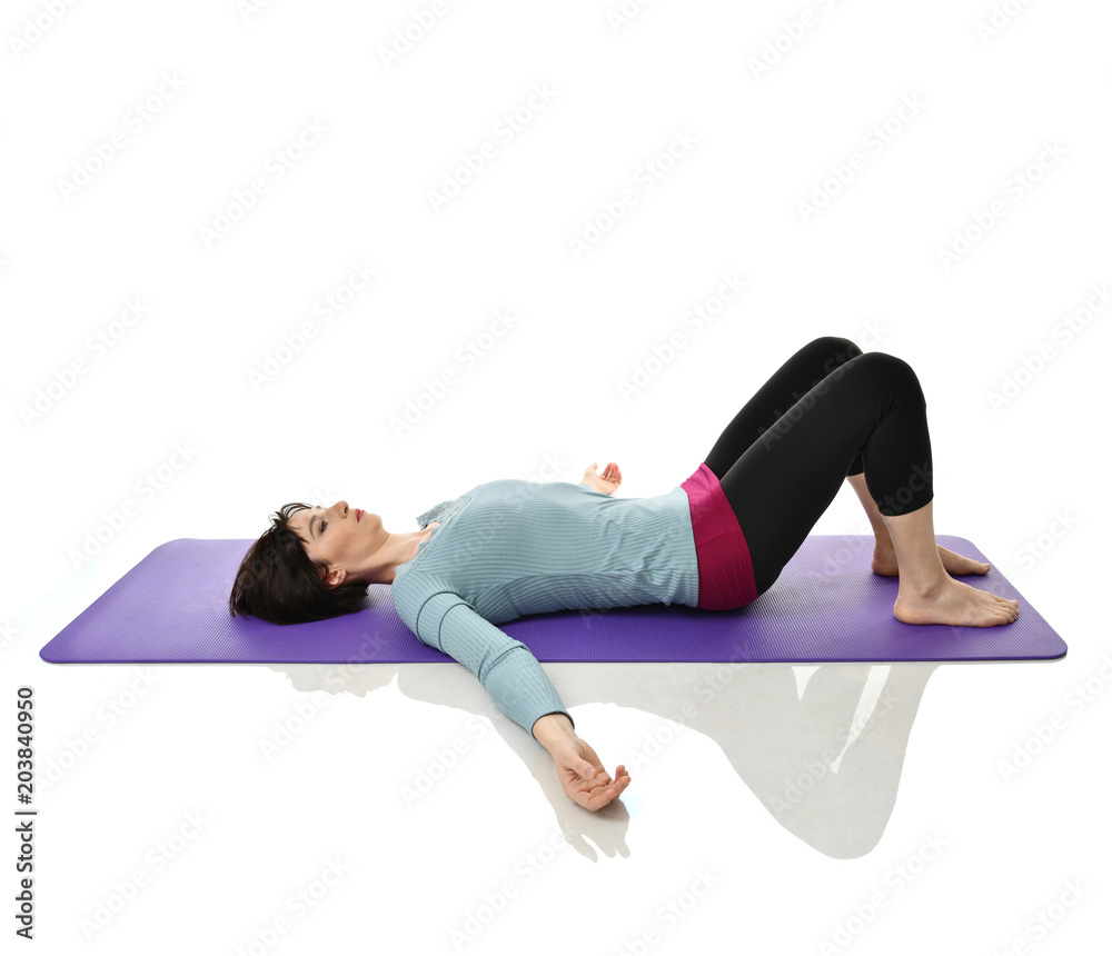 Mother woman exercising doing postnatal workout. Female fitness instructor stretching hands and legs in gym and work out exercises Mother woman exercising doing postnatal workout. Female fitness instructor stretching hands and legs in gym and work out exercises