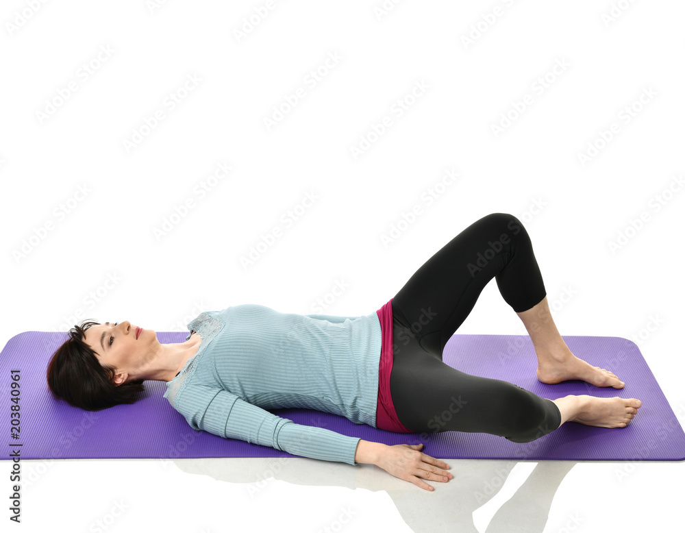 Mother woman exercising doing postnatal workout. Female fitness instructor stretching hands and legs in gym and work out exercises Mother woman exercising doing postnatal workout. Female fitness instructor stretching hands and legs in gym and work out exercises