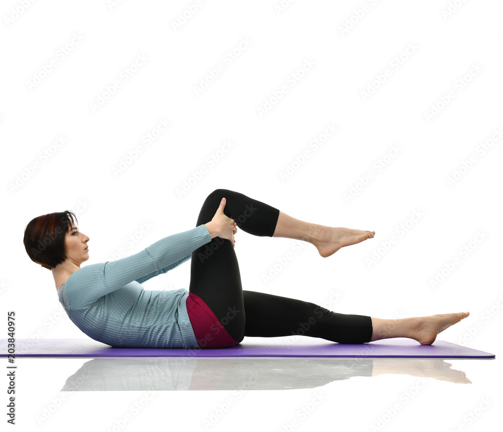 Mother woman exercising doing postnatal workout. Female fitness instructor stretching hands and legs in gym and work out exercises Mother woman exercising doing postnatal workout. Female fitness instructor stretching hands and legs in gym and work out exercises