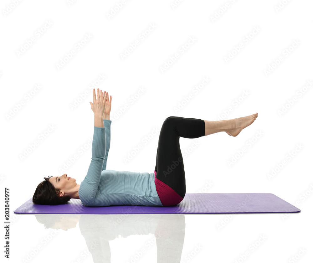 Mother woman exercising doing postnatal workout. Female fitness instructor stretching hands and legs in gym and work out exercises Mother woman exercising doing postnatal workout. Female fitness instructor stretching hands and legs in gym and work out exercises