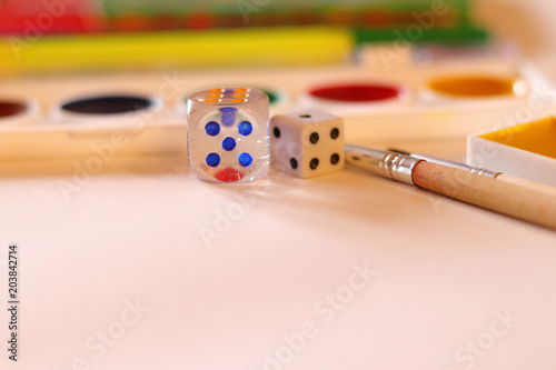 School supplies on the white background: watercolor, pencils and brushes. School and education. Colorful accessories. Preparation for school. Art composition. Drawing and painting.