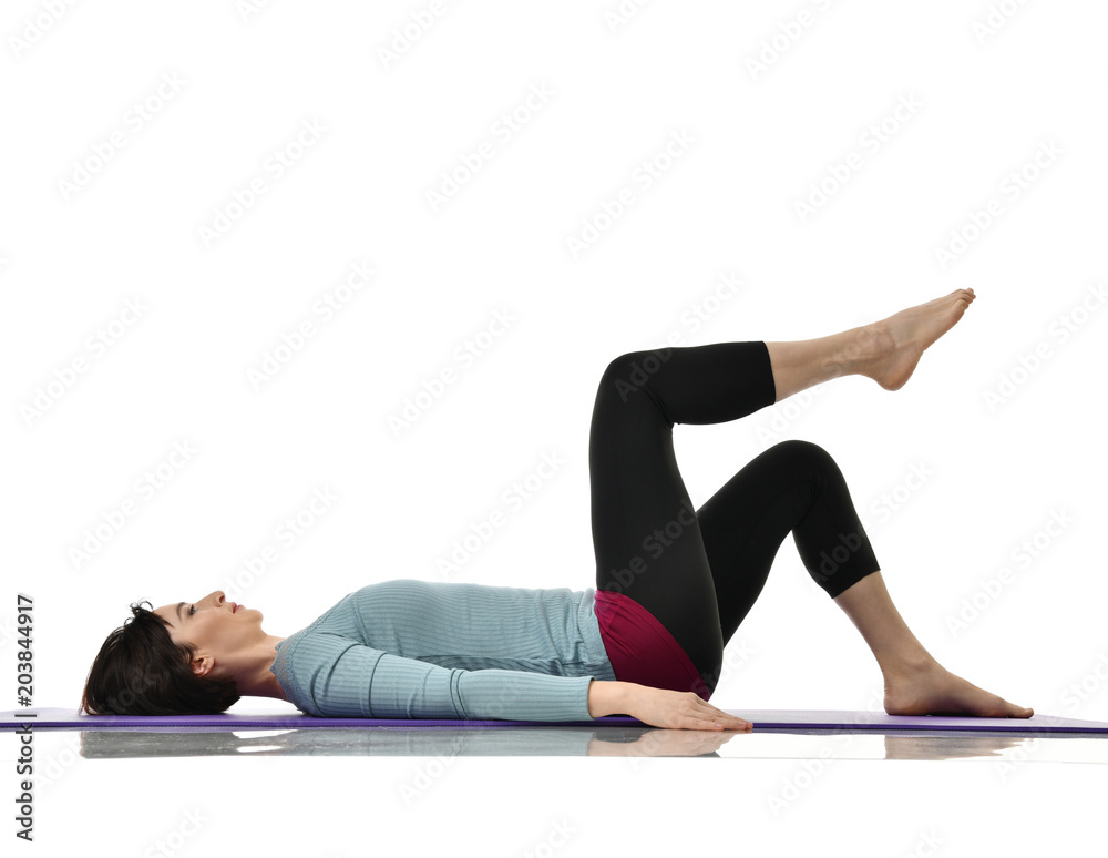 Mother woman exercising doing postnatal workout. Female fitness instructor stretching hands and legs in gym and work out exercises Mother woman exercising doing postnatal workout. Female fitness instructor stretching hands and legs in gym and work out exercises