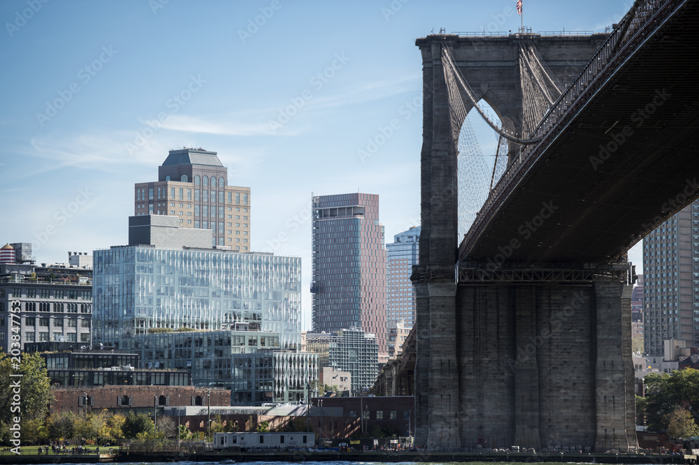 New York City's Brooklyn Bridge and Manhattan skyline in the background. New York City's Brooklyn Bridge and Manhattan skyline in the background.