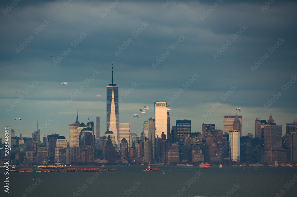 New York City Manhattan skyline panorama at sunset over Hudson River viewed from New Jersey